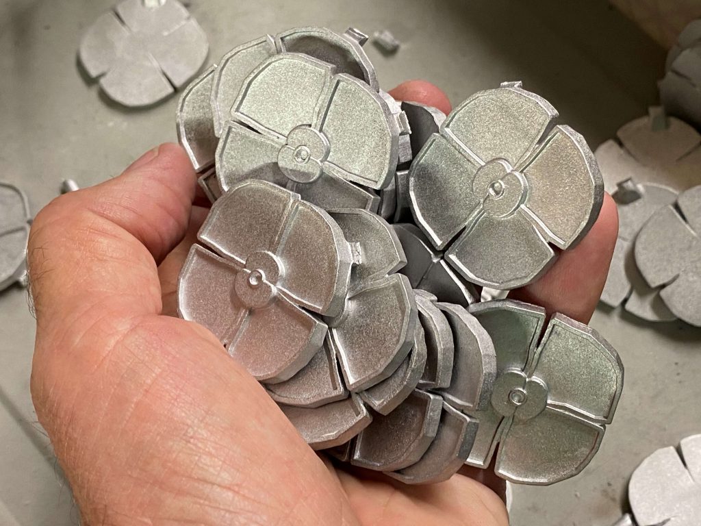 Masterpiece metal poppy centre piece in hand 1024x768 - The story behind this year's RBL Masterpiece Poppy Coin